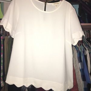 White blouse with scalloped edges
